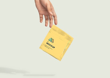 Hand Dropping Paper Bag Mockup